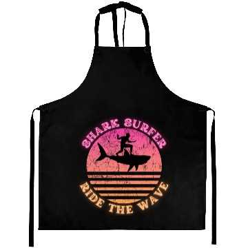 Discover Shark Surfer Ride the Wave Sunset Neon Aprons