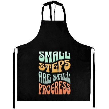 Discover SMALL STEPS ARE STILLPROGRESS Aprons