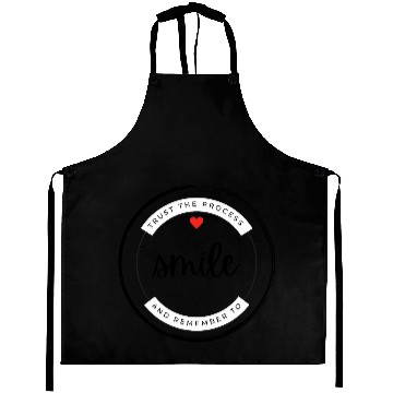 Discover Trust the process and remember to smile Aprons