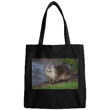 Discover Adorable Otter on the Riverbank Bags