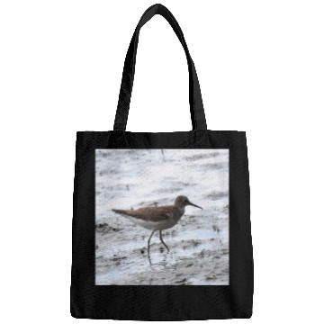 Discover Sandpiper walking along the shore Bags