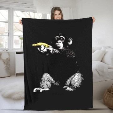 Discover MONKEY SHOOTING BANANA Fleece Blankets