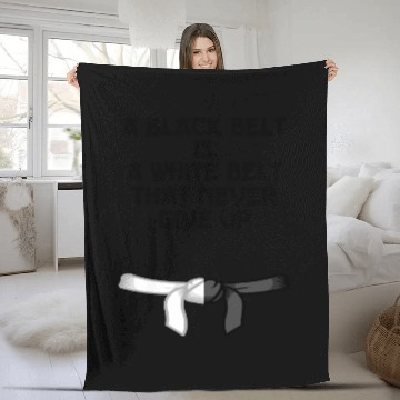Discover a black belt is a white belt that never give up Fleece Blankets