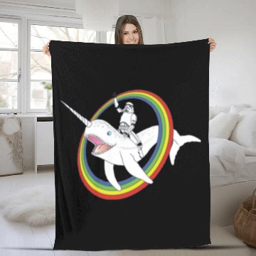 Discover Spaceman riding narwhal through rainbow Fleece Blankets