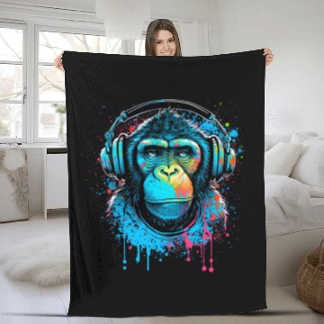 Discover ape, primate, monkey wearing headphones Fleece Blankets
