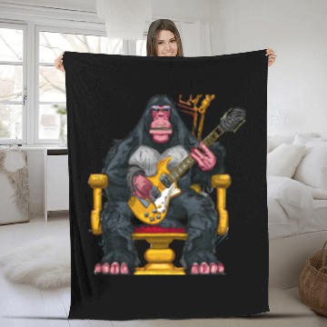 Discover Ape sitting on a throne hold an electric guitar Fleece Blankets