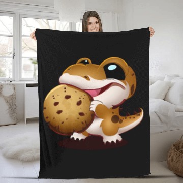 Discover Cute baby dinosaur snacking on a cookie Fleece Blankets