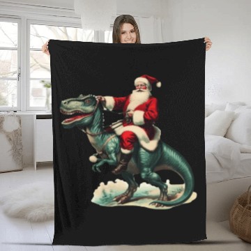 Discover Santa claus riding a dinosaur Fleece Blankets