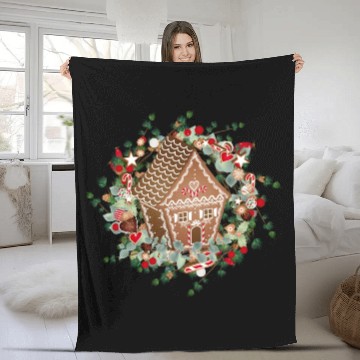 Discover Gingerbread house in a larch wreath for Christmas Fleece Blankets