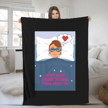 Discover Sad woman in love lying in bed with a blindfold on Fleece Blankets