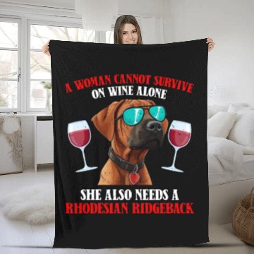 Discover Dog Mom WOMAN CANNOT SURVIVE ON WINE ALONE Fleece Blankets