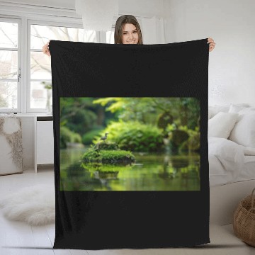 Discover Serene Pond with Bird on Mossy Rock Fleece Blankets