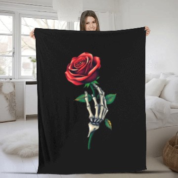 Discover Skeleton Hand Holding a Rose: Beauty in the Dark Fleece Blankets