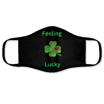 Discover Feeling Lucky with a 4 leaf clover and a ladybug Face Masks