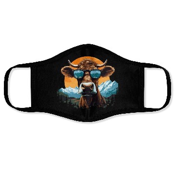 Discover A cow with sunglasses in the mountains Face Masks