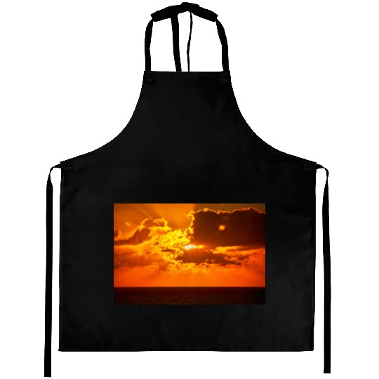 brilliant shining sun behind clouds rises Aprons