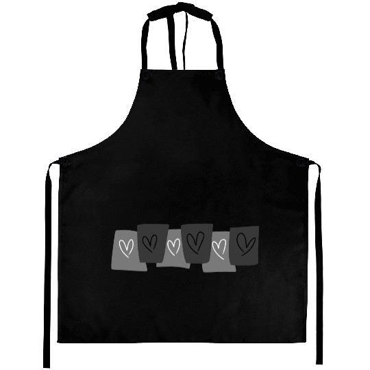 Heart doodle on black card Aprons