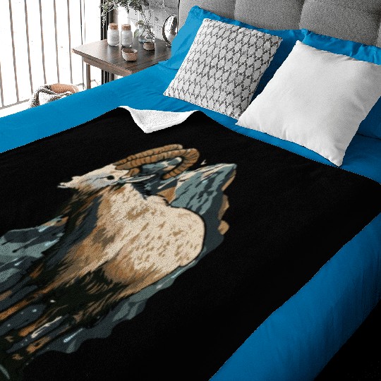 a mountain goat lives in the mountains Baby Blankets
