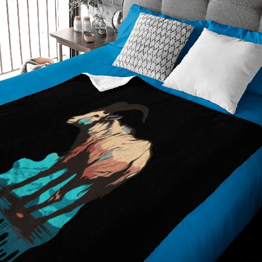 a mountain goat lives in the mountains Baby Blankets