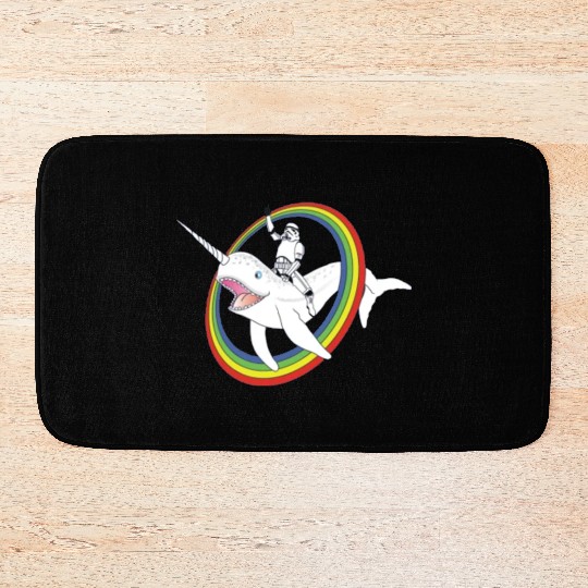 Spaceman riding narwhal through rainbow Bath Mats