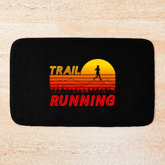 Trail running in orange sunset with mountains Bath Mats
