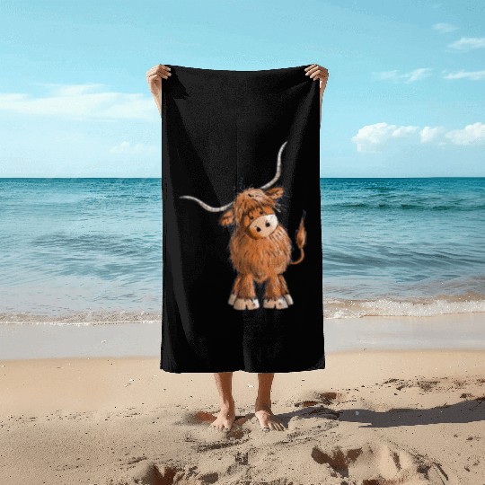 Fluffy and funny scottish highland cow Beach Towels