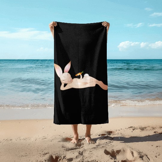 Relaxed rabbit with carrot is enjoying his life Beach Towels