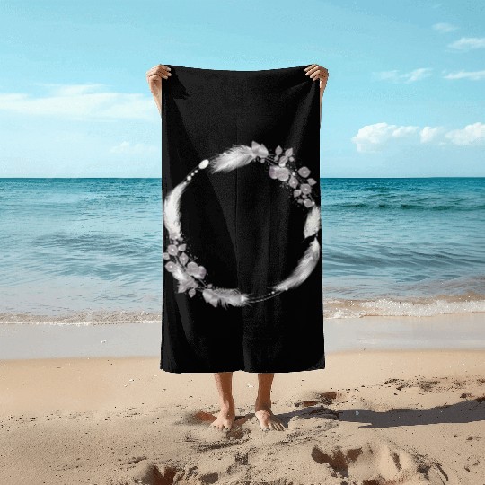 delicate frame of silver colored feathers & leaves Beach Towels