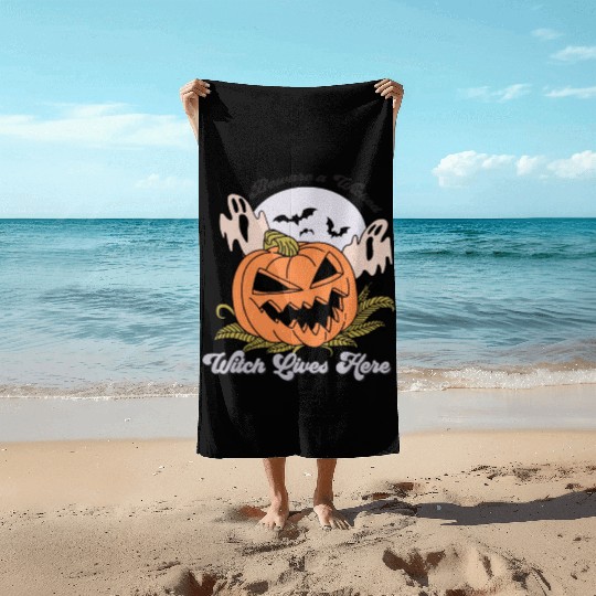 Beware a Wicked Witch Lives Here Beach Towels