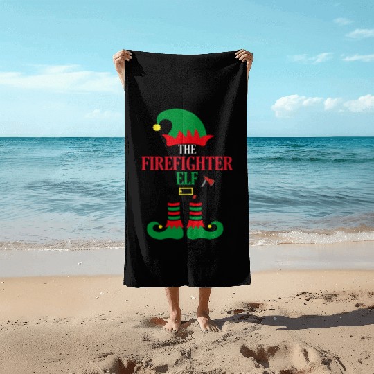 the firefighter elf with axe Beach Towels