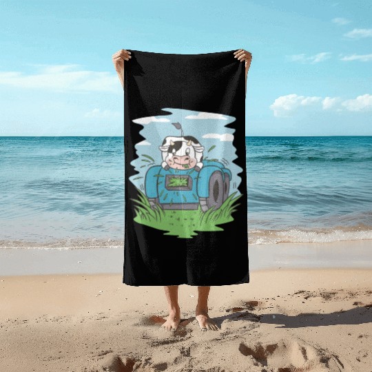 Cow eating grass tractor Cow eating grass tractor Beach Towels