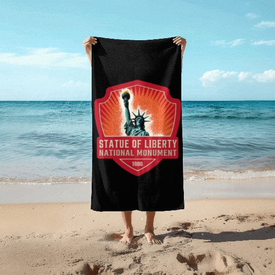 statue of liberty national monument Beach Towels