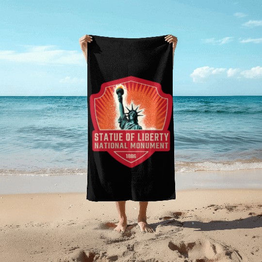 statue of liberty national monument Beach Towels