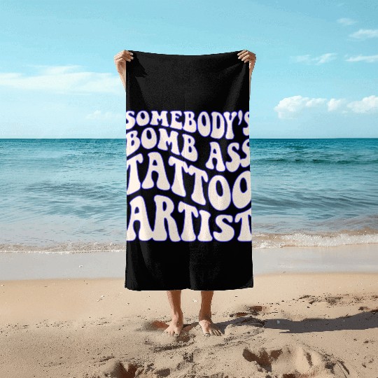 Somebody’s Bomb Ass Tattoo Artist ©WhiteTigerLLC. Beach Towels