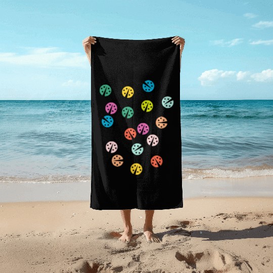 Cute and colorful ladybug Beach Towels