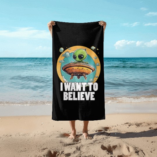 I WANT TO BELIEVE cute alien in spaceship Beach Towels