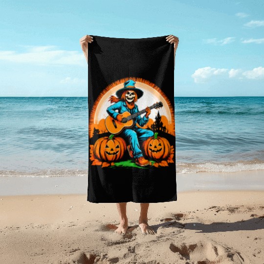 Happy Halloween scarecrow plays guitar Beach Towels