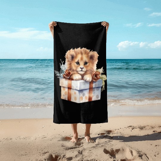 African Lion inside a Christmas gift box Beach Towels