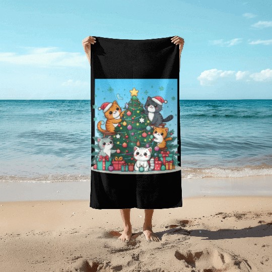 Kittens decorate a Christmas tree Beach Towels
