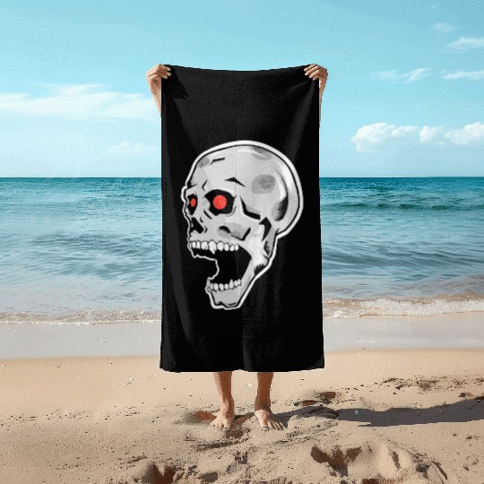 the silver skull looks up Beach Towels
