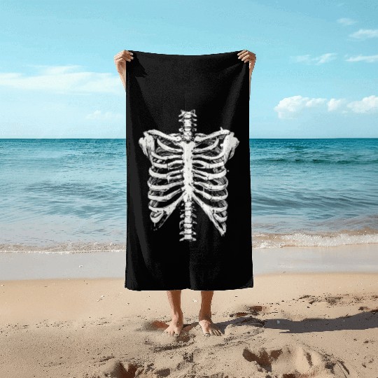 skeleton rib cage spooky halloween Beach Towels
