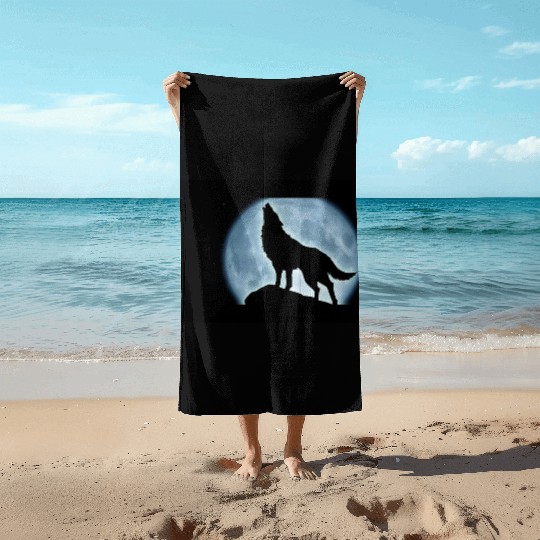 Wolf howling in the moonlight Beach Towels