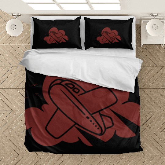 an airplane flying through the clouds Bedding Sets
