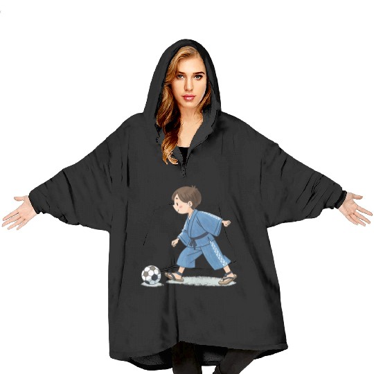 Boy in kimono playing soccer Blanket Hoodies