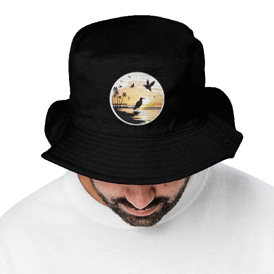 the beach sunset birds Bucket Hats