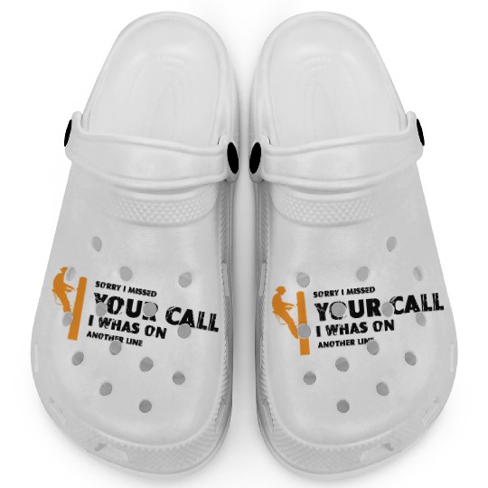 Orange silhouette of a lineman climbing a utility Clogs