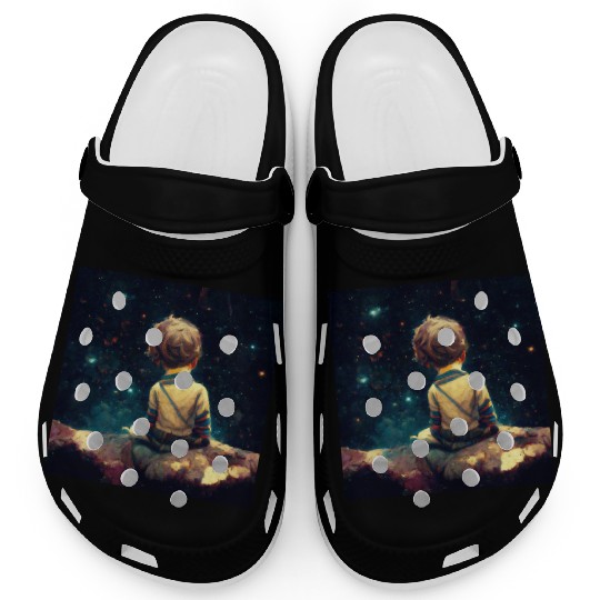 Little boy sitting on the Edge of the Universe Clogs