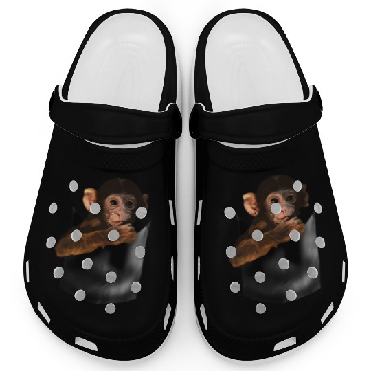 Baby Monkey In Pocket Of Monkey Clogs