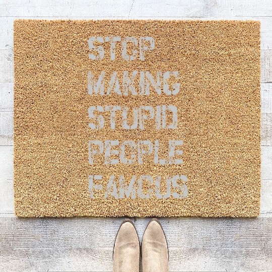 stop making stupid people famous Coir Doormats