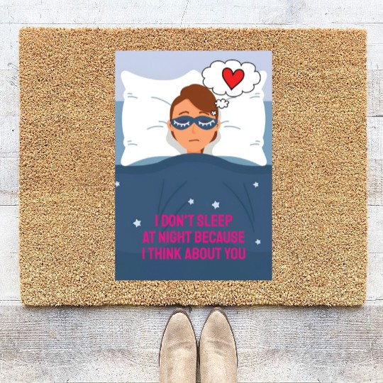 Sad woman in love lying in bed with a blindfold on Coir Doormats